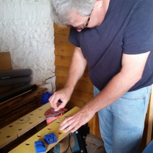 Paul sanding a set of bushes down to the correct fit